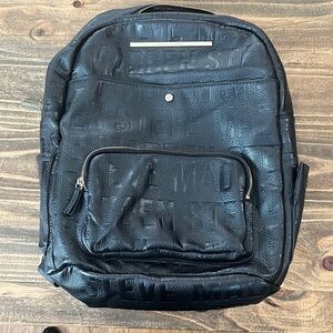 Steve Madden black backpack with logo zippered inside outside pockets